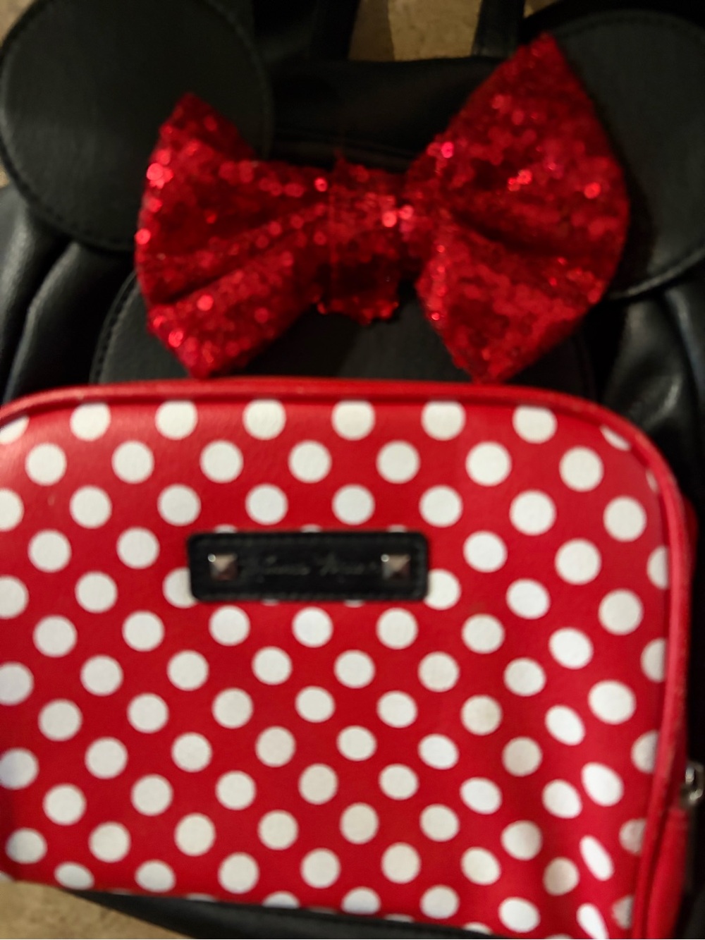 Minnie Mouse mini backpack with glitter bow.